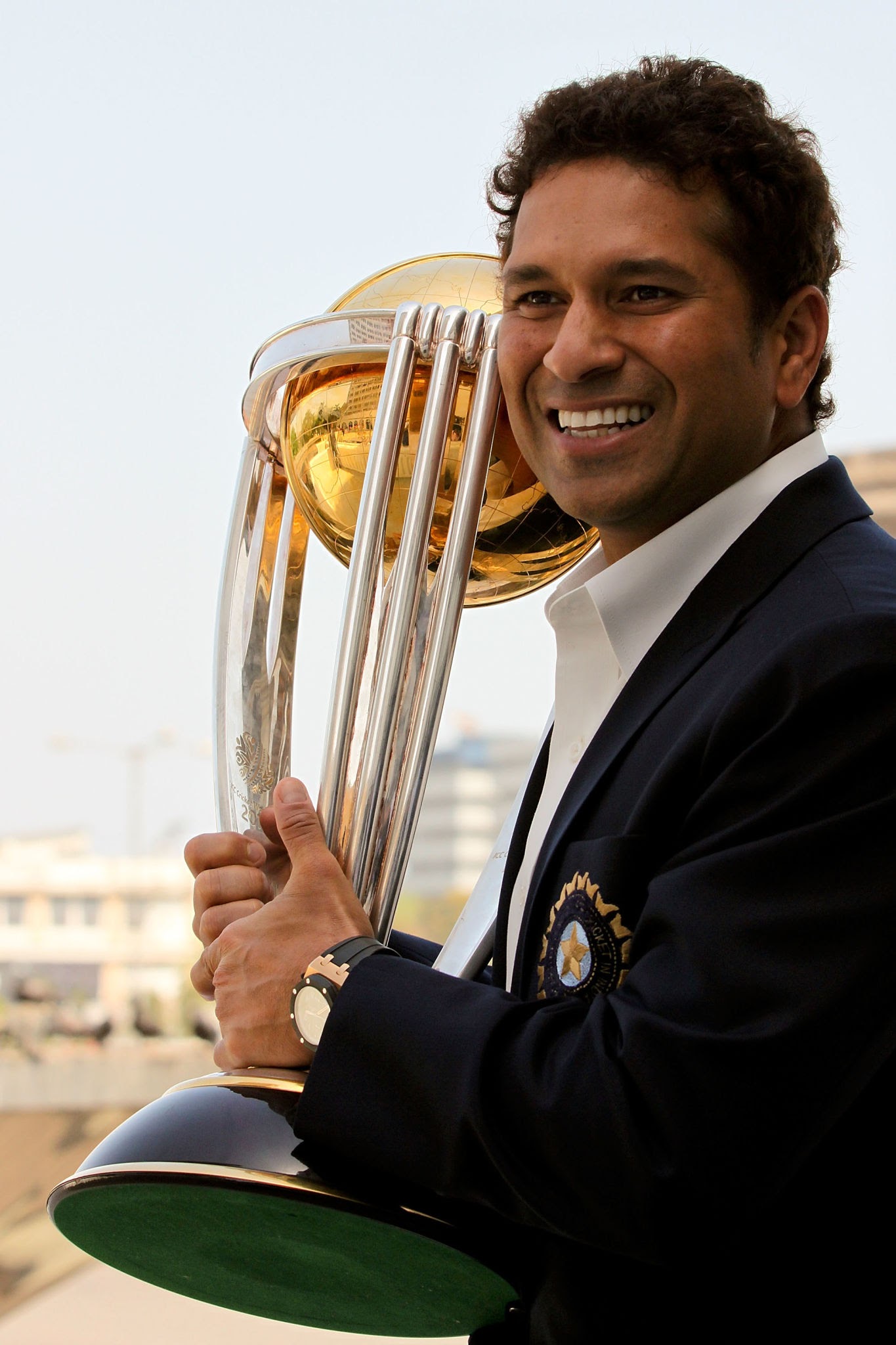 Sachin Tendulkar holding the ICC World Cup trophy representing dedication and hard work
